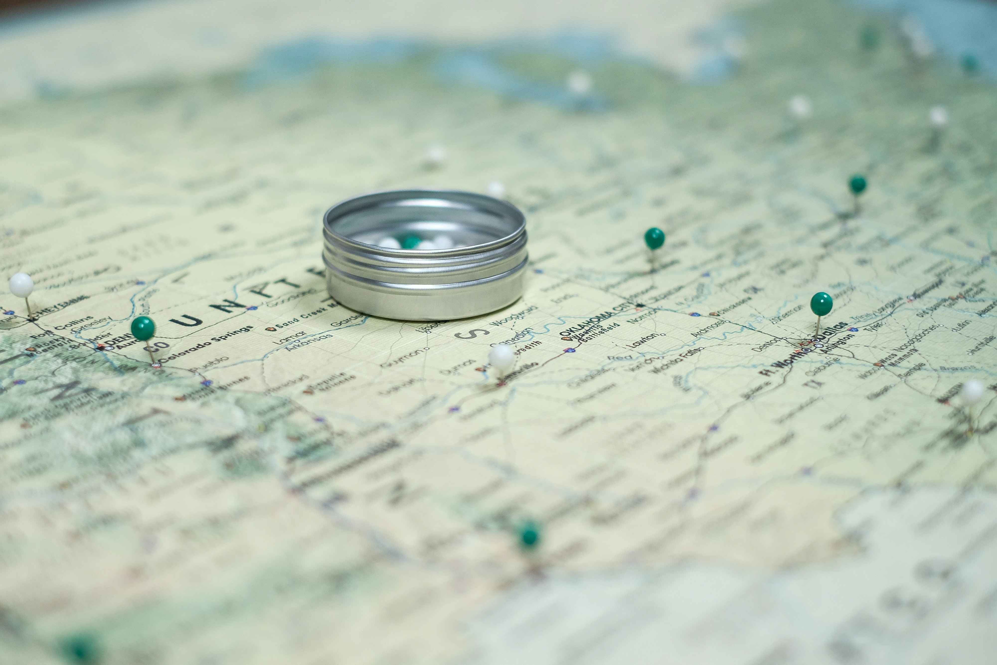 silver ring on white and blue textile